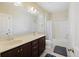 Bathroom featuring a double vanity sink, a large mirror, and a shower/tub combo at 1251 Weather Helm Dr, Mount Pleasant, SC 29466
