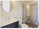Bathroom featuring a marble countertop vanity, toilet, and tiled shower with a glass door at 1251 Weather Helm Dr, Mount Pleasant, SC 29466