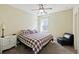 Well-lit bedroom with a ceiling fan, a comfortable bed, and a charming nightstand at 1251 Weather Helm Dr, Mount Pleasant, SC 29466