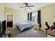 Bedroom featuring large windows, a ceiling fan, comfortable bed, and attached bathroom at 1251 Weather Helm Dr, Mount Pleasant, SC 29466