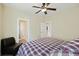 Comfortable bedroom featuring a ceiling fan, inviting bed, and connected bathroom at 1251 Weather Helm Dr, Mount Pleasant, SC 29466