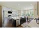 Open-concept kitchen with an island that looks into the living room and the dining area at 1251 Weather Helm Dr, Mount Pleasant, SC 29466