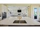Open-concept kitchen with a view to the living room, featuring a kitchen island with seating at 1251 Weather Helm Dr, Mount Pleasant, SC 29466