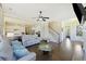 Bright living room featuring hardwood floors and an open floor plan leading to the kitchen at 1251 Weather Helm Dr, Mount Pleasant, SC 29466