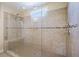 Modern shower with glass doors, tiled walls, and a built-in bench at 1251 Weather Helm Dr, Mount Pleasant, SC 29466