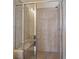 Tiled shower with glass door, featuring a built-in bench and multiple shower heads at 1251 Weather Helm Dr, Mount Pleasant, SC 29466