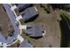 The high-angle shot captures the roof of the home nestled in a quiet community next to a small lake at 126 Citrea Dr, Summerville, SC 29483