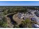 Beautiful aerial view of community homes surrounding a tranquil pond and lush green trees at 126 Citrea Dr, Summerville, SC 29483