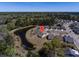 An aerial view of houses with a pond and trees is pinpointed with a map marker at 126 Citrea Dr, Summerville, SC 29483