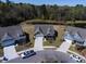 An aerial view showcases this beautiful home located near a serene pond within a lovely community at 126 Citrea Dr, Summerville, SC 29483