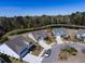 An aerial view shows the neighborhood homes surrounding a beautiful lake and tree line at 126 Citrea Dr, Summerville, SC 29483