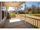 Screened back porch with seating and a view of the landscaped backyard at 126 Citrea Dr, Summerville, SC 29483