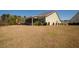 Expansive backyard featuring a green lawn, patio, and the rear of the house at 126 Citrea Dr, Summerville, SC 29483