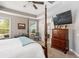 Spacious bedroom with a four-poster bed, TV, desk and natural light at 126 Citrea Dr, Summerville, SC 29483