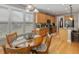 Sunlit breakfast nook with wood table, cushioned chairs, and large windows with natural light at 126 Citrea Dr, Summerville, SC 29483