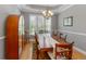 Dining area featuring a spacious table, six chairs, and a charming china cabinet with glass doors at 126 Citrea Dr, Summerville, SC 29483