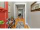 Bright foyer leads to the home with hardwood floors, decorative mirror, and hallway view at 126 Citrea Dr, Summerville, SC 29483