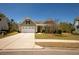 The inviting single-Gathering home with an attached garage is enhanced by a meticulously maintained lawn at 126 Citrea Dr, Summerville, SC 29483