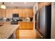 Updated kitchen with stainless appliances, granite countertops, and wooden cabinets at 126 Citrea Dr, Summerville, SC 29483