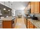 Spacious kitchen with stainless steel appliances, granite countertops, and a view of dining area at 126 Citrea Dr, Summerville, SC 29483