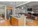 Island kitchen with granite countertops, stainless appliances, overlooking the connected living and dining space at 126 Citrea Dr, Summerville, SC 29483