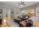 Inviting living room featuring hardwood floors, gray walls, leather furniture and an open view into the kitchen at 126 Citrea Dr, Summerville, SC 29483