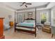 Comfortable main bedroom with a four-poster bed, carpet, and bright natural light at 126 Citrea Dr, Summerville, SC 29483
