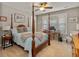 Cozy main bedroom with four-poster bed, carpet, and ample natural light from large windows at 126 Citrea Dr, Summerville, SC 29483