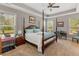 Bright main bedroom with four-poster bed, carpet, sitting area, and abundant natural light at 126 Citrea Dr, Summerville, SC 29483