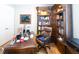 Charming office space featuring a custom desk, hardwood floors, and built-in bookshelves at 126 Citrea Dr, Summerville, SC 29483