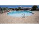 Community swimming pool with lounge chairs, umbrellas, and a clubhouse at 126 Citrea Dr, Summerville, SC 29483