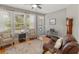 Comfortable sitting area with backyard views, hardwood floors, and a pet kennel at 126 Citrea Dr, Summerville, SC 29483