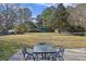 Large, expansive backyard featuring mature trees and a storage shed, perfect for outdoor activities and relaxation at 1264 Fort Dr, Hanahan, SC 29410