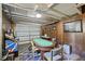 Finished basement with a black jack table, arcade game and wood paneled walls at 1264 Fort Dr, Hanahan, SC 29410