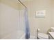 Clean bathroom featuring a tub with shower, toilet, and vanity with flamingo artwork at 1264 Fort Dr, Hanahan, SC 29410