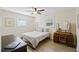 Sunlit bedroom featuring hardwood floors, a ceiling fan, natural light, and classic wooden furniture at 1264 Fort Dr, Hanahan, SC 29410