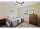 Comfortable bedroom featuring natural light, carpet, ceiling fan, and classic wooden furniture at 1264 Fort Dr, Hanahan, SC 29410