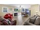 Inviting living area boasts a fireplace, TV, a kitchen view, and plush seating for relaxing and entertaining at 1264 Fort Dr, Hanahan, SC 29410