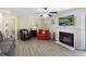 Cozy living room featuring a fireplace, ceiling fan, and neutral decor at 1264 Fort Dr, Hanahan, SC 29410