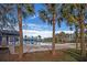 Large community pool with ample seating, palm trees, and a bright blue sky at 131 Brant Dr, Summerville, SC 29483
