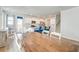 Dining room view featuring a long wood table, white chairs and kitchen access at 131 Brant Dr, Summerville, SC 29483
