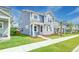 Two-story home with blue siding, well-manicured lawn, and neatly landscaped flower beds at 131 Brant Dr, Summerville, SC 29483