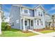 Charming two-story home with blue siding, white trim, and a well-manicured front yard at 131 Brant Dr, Summerville, SC 29483