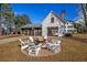 Inviting outdoor fire pit area with Adirondack chairs for gatherings and a covered picnic pavilion at 131 Brant Dr, Summerville, SC 29483