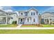 Charming two-story home with blue siding, white trim, landscaped yard, and a welcoming porch at 131 Brant Dr, Summerville, SC 29483