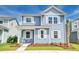 Attractive two-story home with blue siding, white trim, landscaped yard, and a welcoming porch at 131 Brant Dr, Summerville, SC 29483