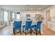 Stylish kitchen island with white cabinets, granite countertops, and comfortable blue bar stools at 131 Brant Dr, Summerville, SC 29483