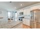 Bright kitchen with stainless steel appliances, granite counters, and modern backsplash at 131 Brant Dr, Summerville, SC 29483