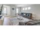 Bright living room with a gray sofa, wood floors, and stylish decor at 131 Brant Dr, Summerville, SC 29483