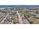 Aerial view of a neighborhood with tree-lined streets, showcasing the home's location in a serene environment at 134 Country Oaks Ln, Wando, SC 29492